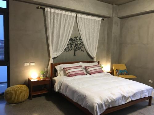 A bed or beds in a room at LaVie GANDAN