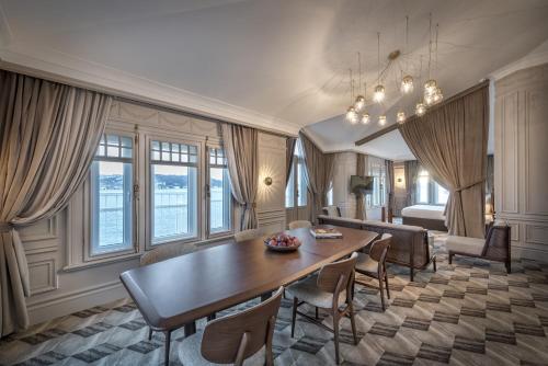 a living room with a wooden table and chairs at The Stay Bosphorus in Istanbul