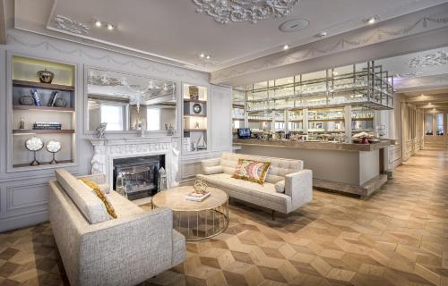 a living room with two couches and a fireplace at The Stay Bosphorus in Istanbul
