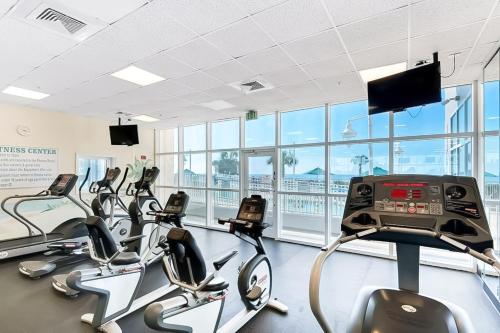a gym with treadmills and elliptical machines at Majestic Sun in Destin