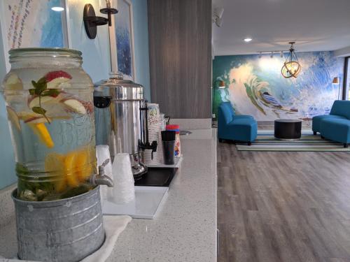 a kitchen with a jar filled with liquid on a counter at Tropical Seas Hotel in Myrtle Beach