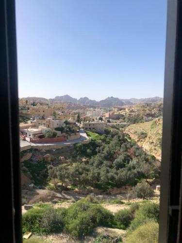 a view of a city from a window at Petra Plaza Hotel in Wadi Musa
