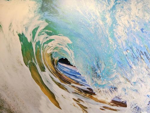 a painting of a wave in the ocean at Tropical Seas Hotel in Myrtle Beach