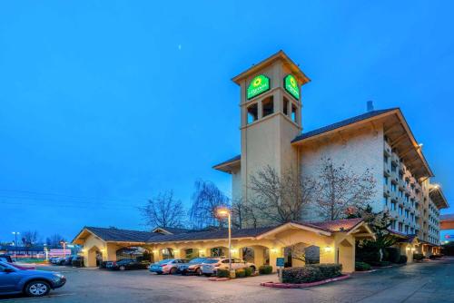 a clock tower in the middle of a city at La Quinta by Wyndham Seattle Sea-Tac Airport in SeaTac