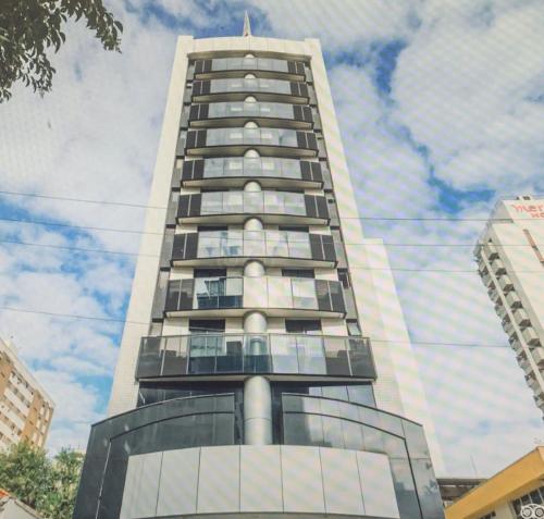 a tall building with windows on the side of it at Jardim Paulista Apartamento com Vista in Sao Paulo