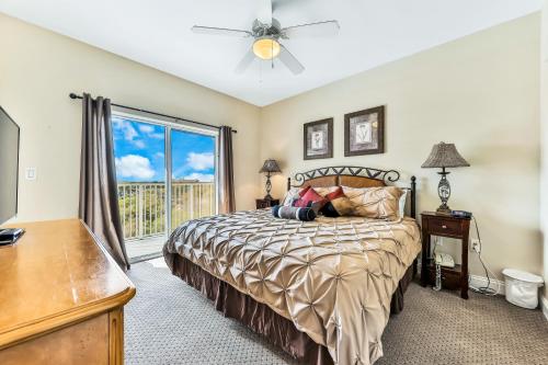 a bedroom with a bed and a large window at Enchantment at Blue Heron in Orlando