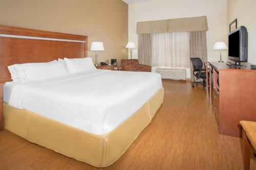 a large white bed in a hotel room at Holiday Inn Express & Suites Glendive by IHG in Glendive