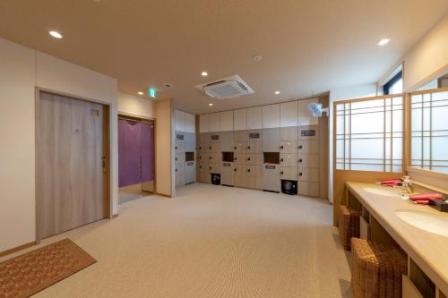 Posteľ alebo postele v izbe v ubytovaní Dormy Inn Premium Fukui Natural Hot Spring
