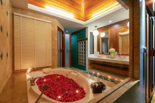 a bathroom with a large tub filled with red substance at Railay Bay Resort & Spa in Railay Beach