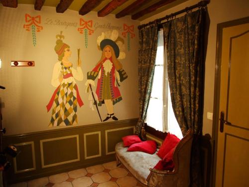 a girl in a pink dress and a girl in a pink dress at Hotel de Nesle in Paris
