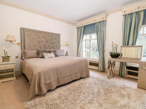 Un pat sau paturi într-o cameră la Gleneagles