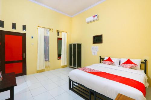 Кровать или кровати в номере OYO 3100 El Shaday Family Residence