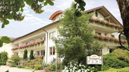 a building with a sign in front of it at Landhotel Buchbergerhof in Grafenwiesen