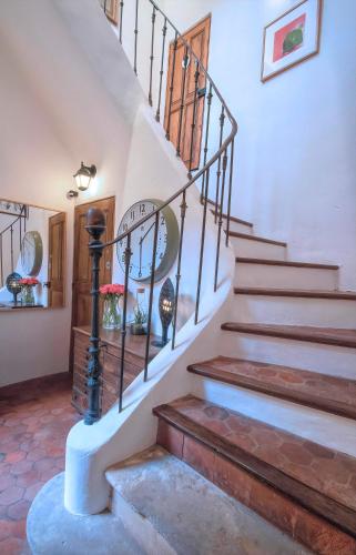 a staircase in a house with wooden steps at Cent Cinq - unique apartments in the heart of Apt in Apt