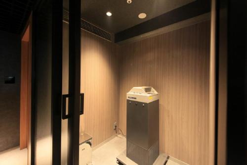 a small bathroom with a toilet in a room at Richmond Hotel Premier Kyoto Ekimae in Kyoto