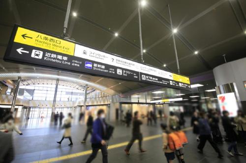 a crowd of people walking in a subway station at Richmond Hotel Premier Kyoto Ekimae in Kyoto