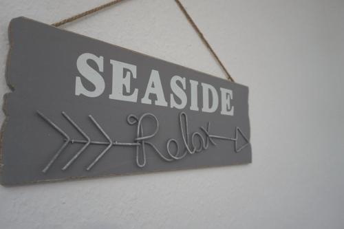 a sign that readsseated hall hanging on a wall at 50180... in Harlesiel