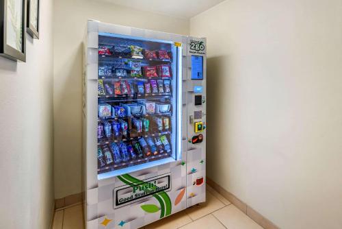a refrigerator filled with lots of drinks in a room at Sleep Inn near Washington State Line in Post Falls