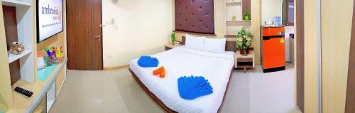 a hospital room with a bed with blue drawings on it at Walking Street Residence - Boutique Suites near the Beach & Walking Street in Pattaya South
