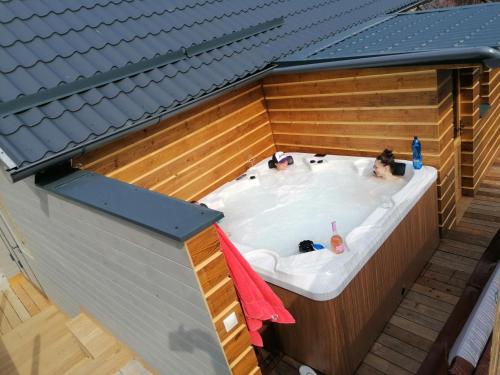 three people in a hot tub in a building at Apartments Pemikas I in Liptovský Mikuláš