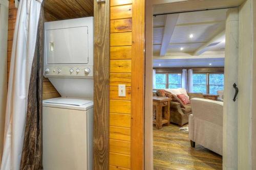 a kitchen and living room in a tiny house at Creekside R&R in Blue Ridge