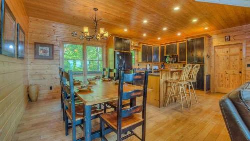 a dining room and kitchen with a table and chairs at CloudWalker in Morganton