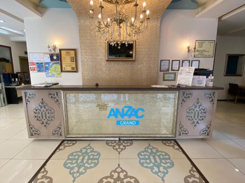a lobby with aaa grand counter in a building at Grand Anzac Hotel in Çanakkale