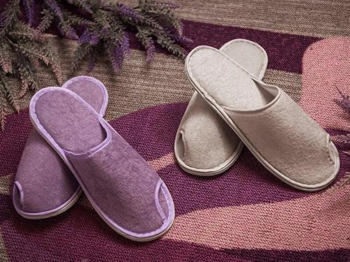a pair of purple shoes sitting on a rug at Lavande Hotels·Kunshan Renmin Road in Suzhou