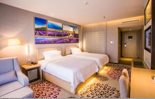 Ένα ή περισσότερα κρεβάτια σε δωμάτιο στο Lavande Hotel Guilin Convention and Exhibition Center