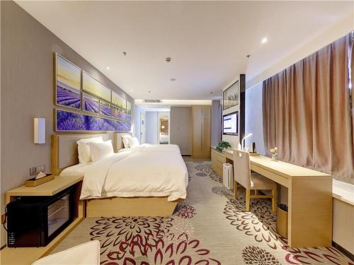 Postel nebo postele na pokoji v ubytování Lavande Hotel Chengdu Dafeng Shixi Park Subway Station