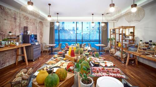 a buffet of fruits and vegetables on a table at Radisson Blu Hotel, Kyiv Podil City Centre in Kyiv