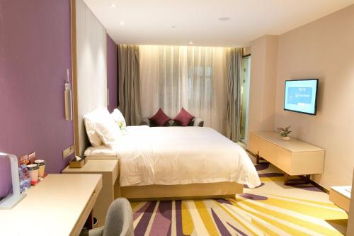 Ένα ή περισσότερα κρεβάτια σε δωμάτιο στο Lavande Hotels·Shenzhen North Railway Station Longhua Yicheng Center