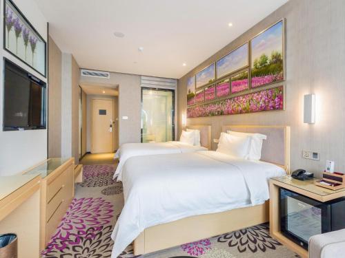 Ένα ή περισσότερα κρεβάτια σε δωμάτιο στο Lavande Hotels·Foshan Nanhai Dali New Metropolis