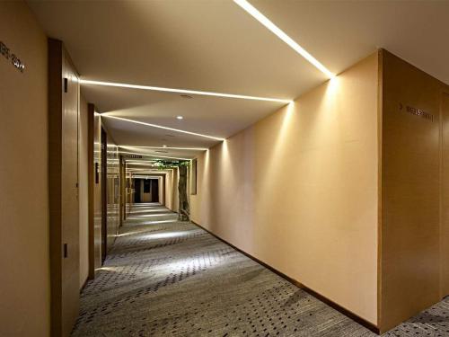 a hallway of a building with a long corridor at Lavande Hotels·Guilin Central Square Elephant Trunk Hill Scenic Area in Guilin