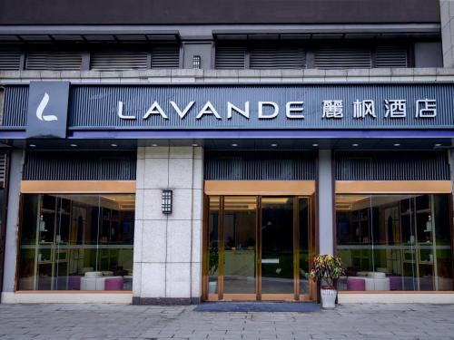 a large building with a sign that readsianearies at Lavande Hotel Chongqing West Station Baguo Cheng in Chongqing