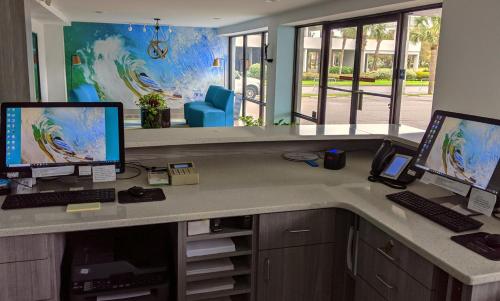 an office with two computers on a desk at Tropical Seas Hotel in Myrtle Beach