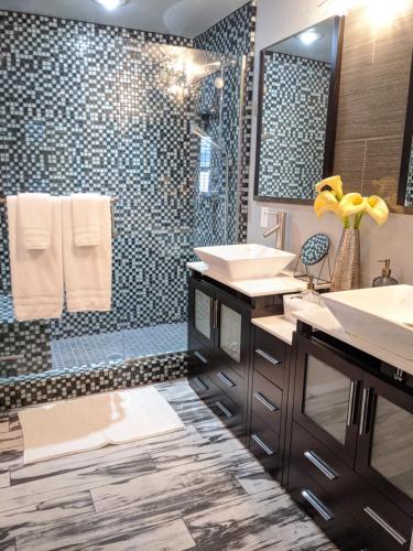 a bathroom with two sinks and a shower at *NEW* Lux Scottsdale Home with Pool, Hot Tub, and Gym in Scottsdale