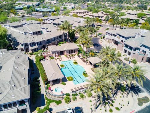 an aerial view of a resort with a pool and palm trees at *NEW* Lux Scottsdale Home with Pool, Hot Tub, and Gym in Scottsdale