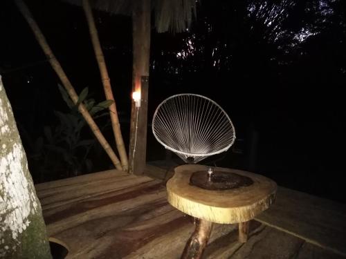 a lamp on top of a wooden table at Casa Bambután in Palenque