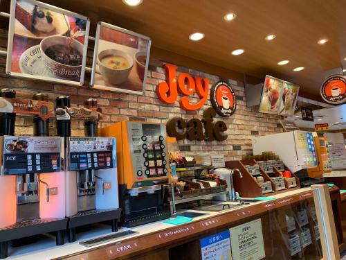 a coffee shop with a counter with coffee machines at Ecot Shimozato 3 in Miyako Island