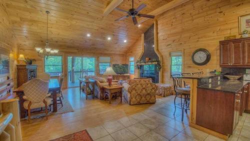 a living room with a kitchen and a dining room at Pure Pleasure on the Lake in Blairsville