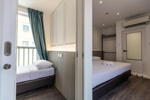 Postel nebo postele na pokoji v ubytování Philip Hotel