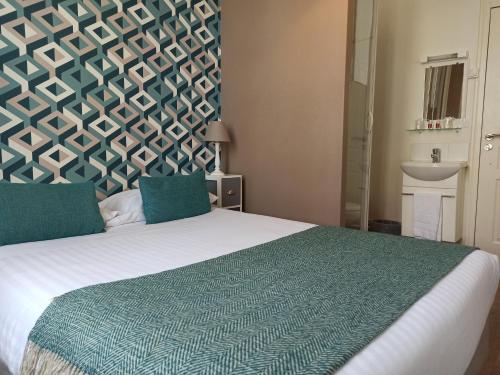 Un ou plusieurs lits dans un hébergement de l'établissement Hotel Val De Loire