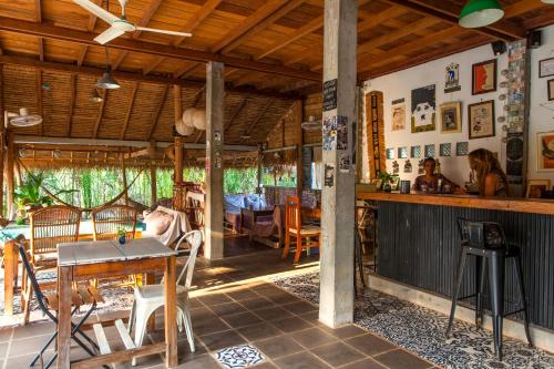 a kitchen and dining room with a table and chairs at Retro Kampot Guesthouse in Kampot