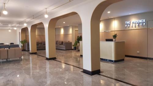 a lobby of a hospital with a waiting room at The Phoenix Hotel Bangkok - Suvarnabhumi Airport in Lat Krabang