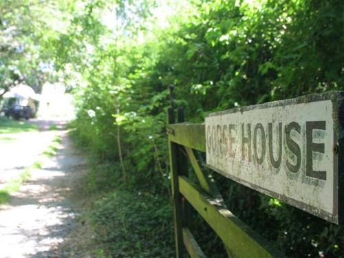 a sign that reads tree house next to a trail at The Linhay in Faringdon