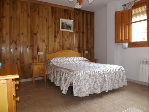 Giường trong phòng chung tại Alojamiento Rural Mirador del Avellano