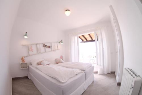 Un pat sau paturi într-o cameră la Casa del Mar