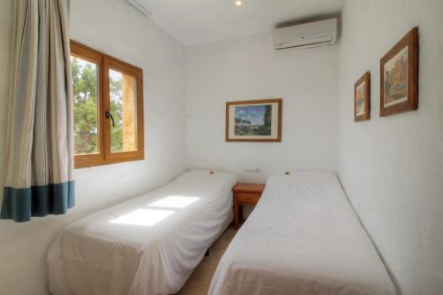 Letto o letti in una camera di Hotel Club Sunway Punta Prima