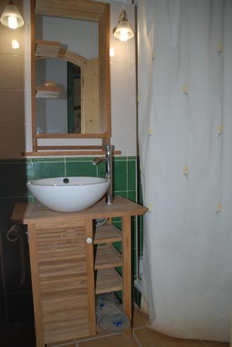 a bathroom with a sink and a mirror at Casa La Catalina III in Beceite